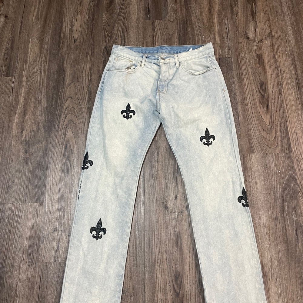 Stylish Light Blue Jeans with Black Fleur-de-Lis Negotiable